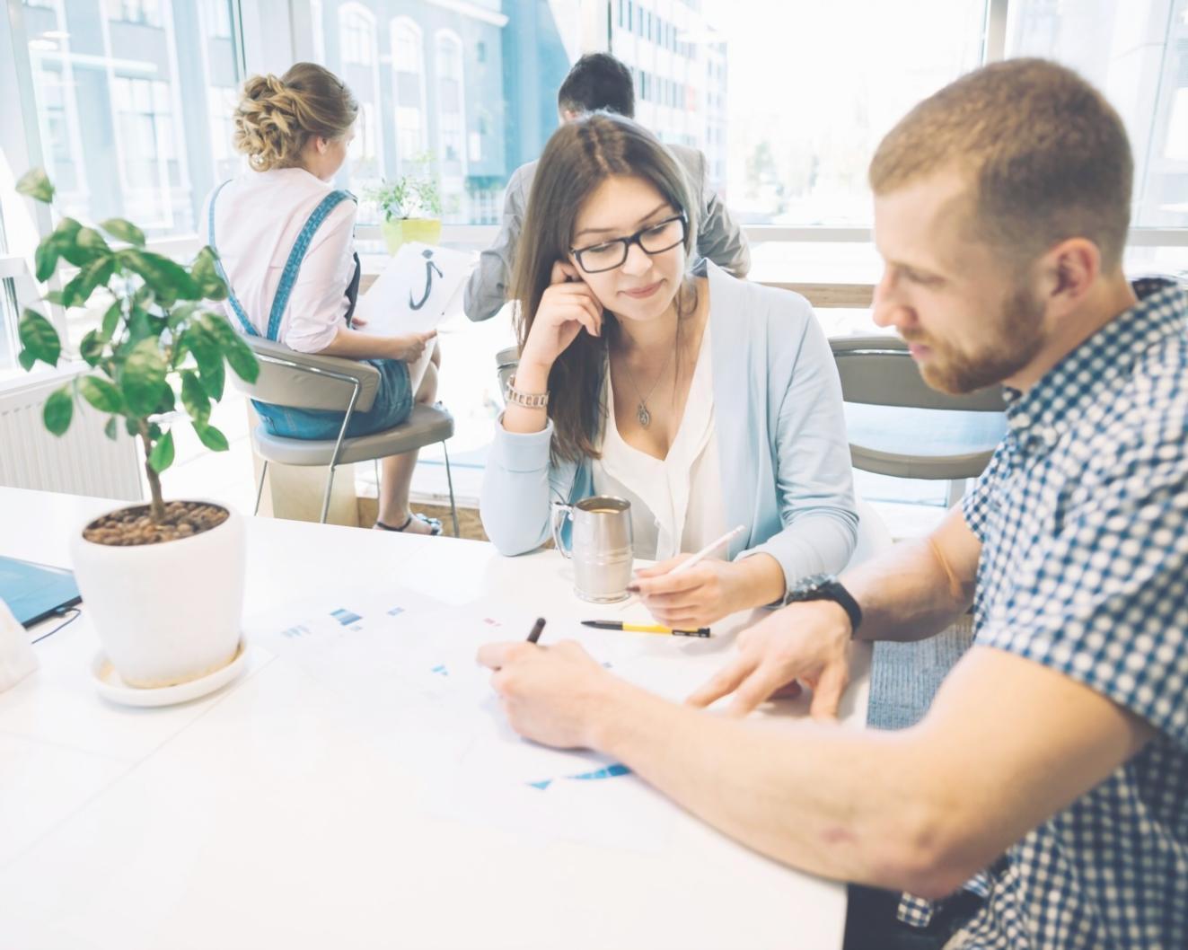 Close-up of financial analysis with charts and calculator showing practical business planning