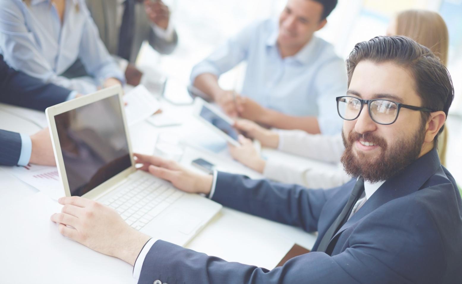 Professional business consultation meeting with financial documents and planning materials