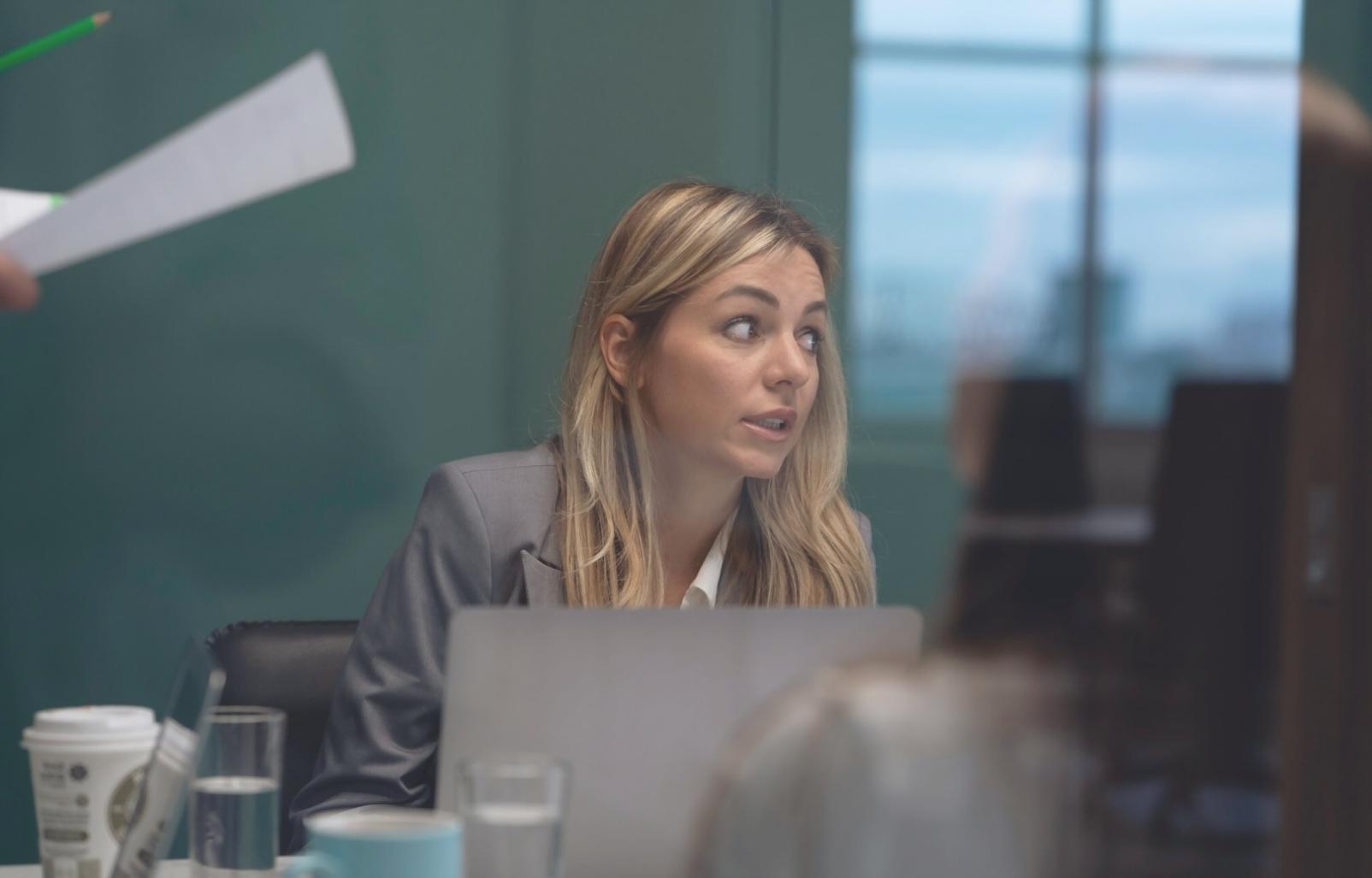 Professional business finance workshop with instructor explaining financial concepts to engaged students