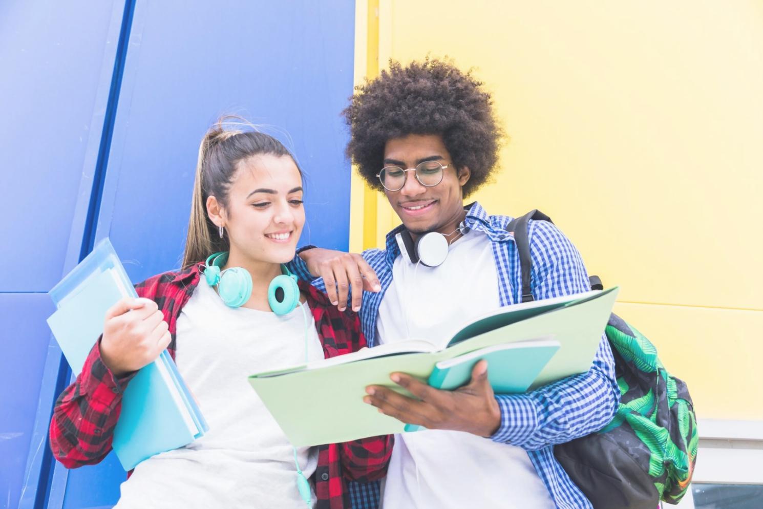 Students collaborating on financial analysis projects in modern learning environment